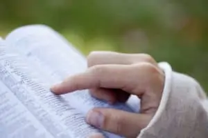 girl reading her Bible